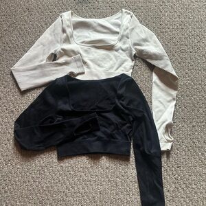 Amazon Cream and Black Asymmetrical Cut Out Bodysuits